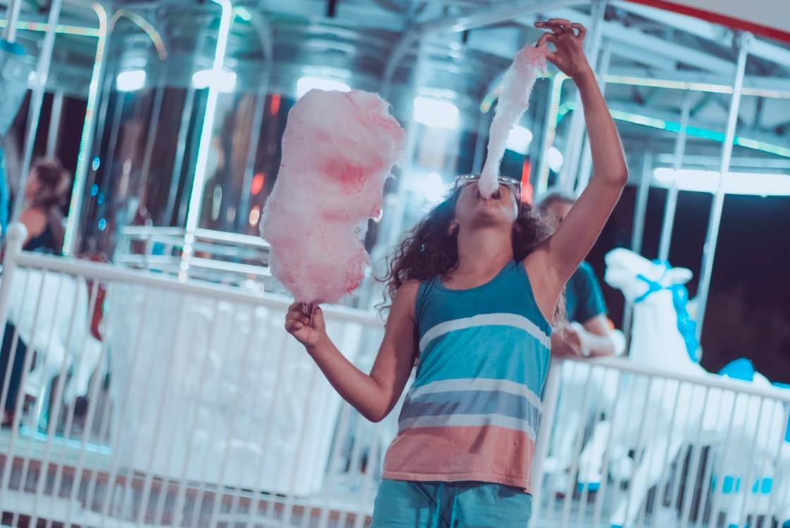 girl eating large candy floss - sugar connection to diabetes